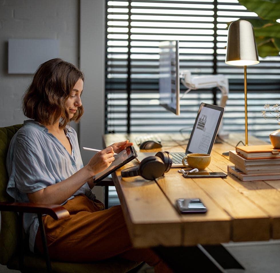 creative-woman-with-a-digital-tablet-at-home-office