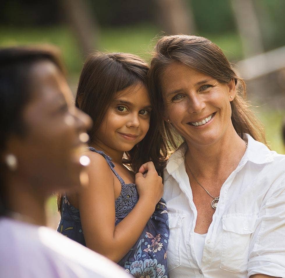 roup-of-women-and-children-outdoors-laughing
