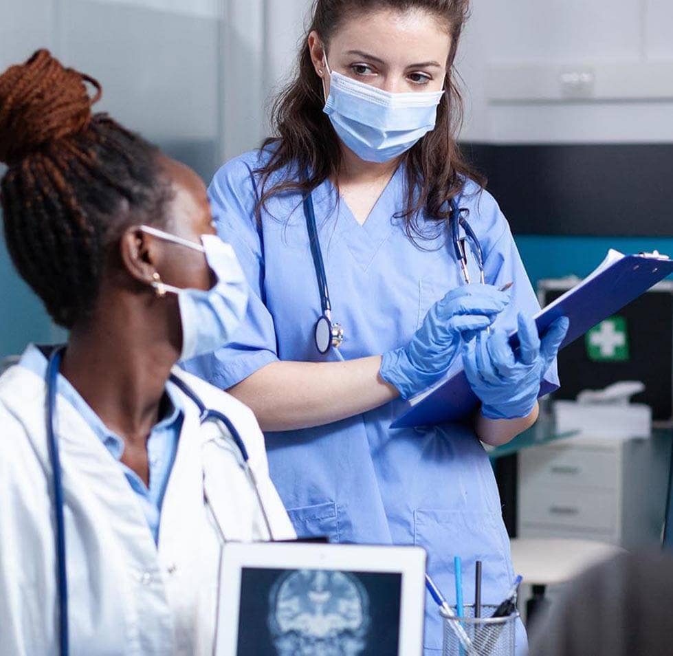 doctor-and-nurse-discussing-treatment