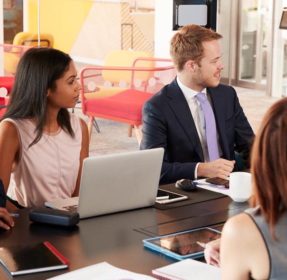 3 people meeting in an office