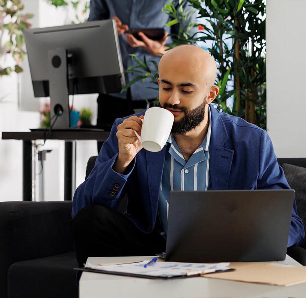 entrepreneur enjoying coffee while working