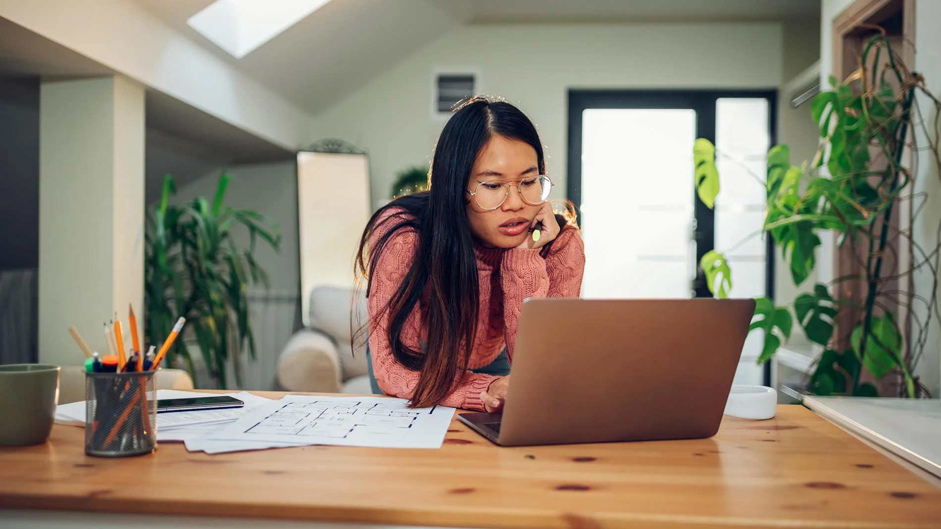 lady using a laptop in her home
