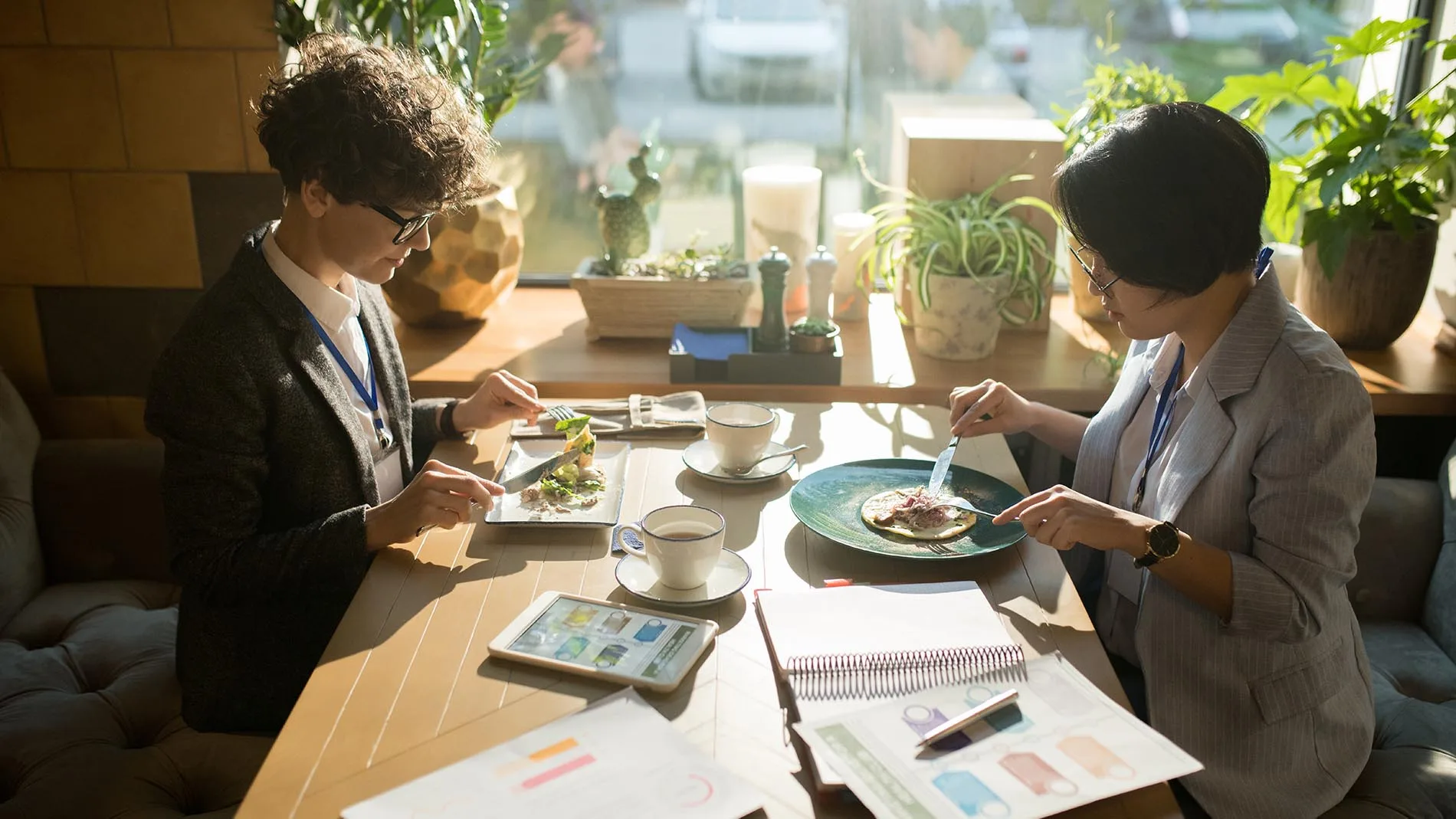 2 people eating food at a table