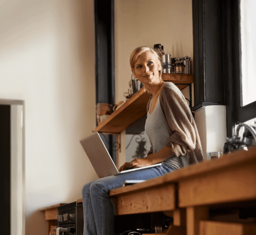 Woman sitting at a desk with a laptop