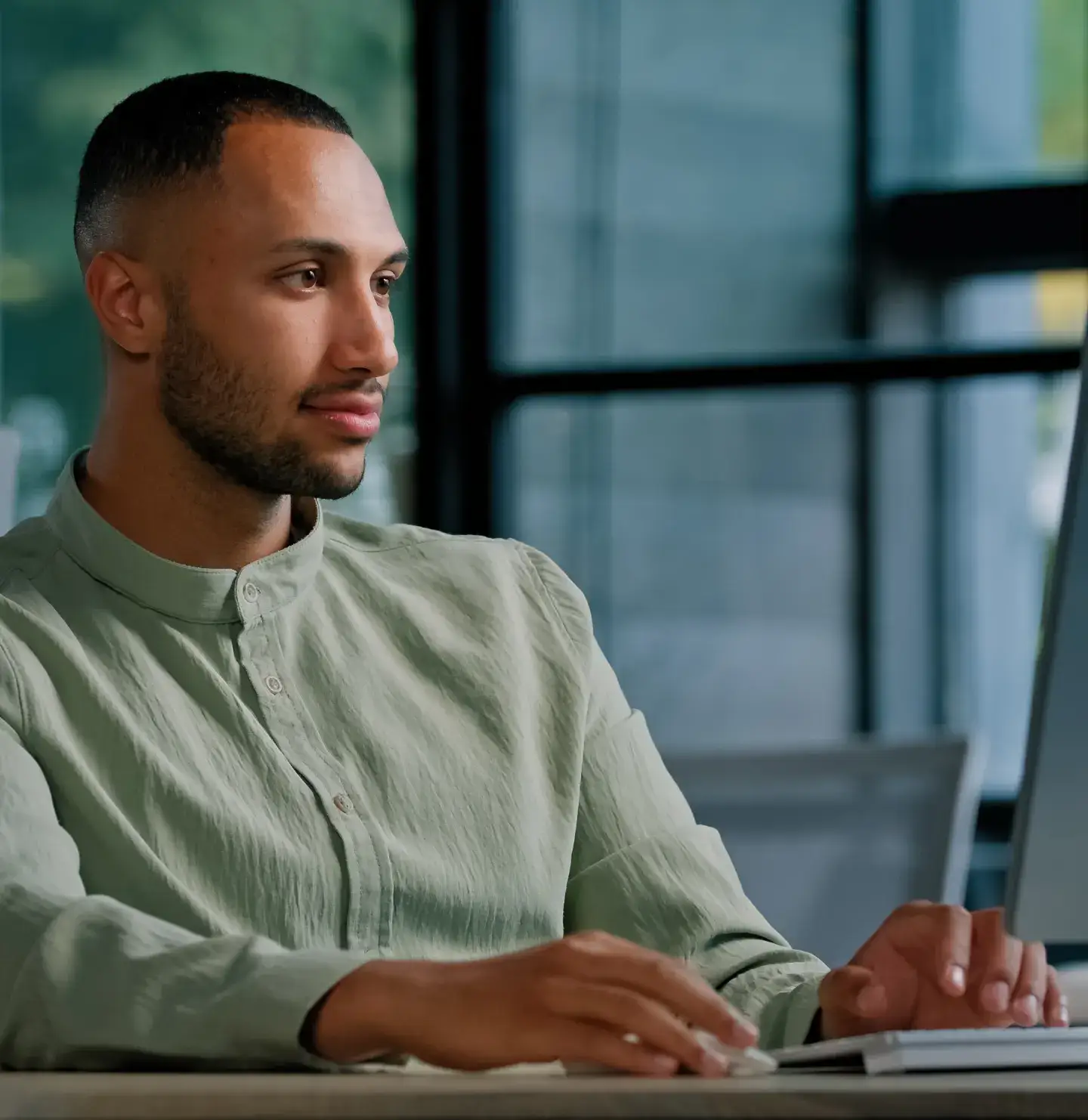Man working at a computer in an office