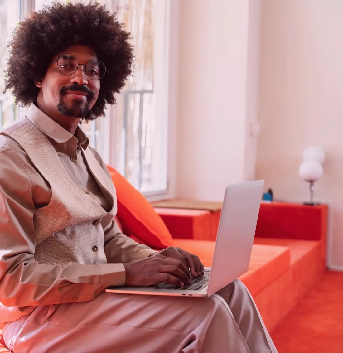 Man seated with a laptop at home